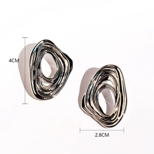 Modern silver irregular liquid metal earrings with abstract spiral wave pattern