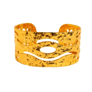 Vintage hammered gold cuff bangle with wide openwork geometric patterns on white background