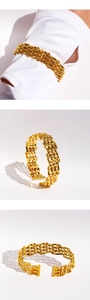 Detailed view of gold mesh hollow woven cuff bracelet showing layered texture and open design