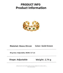 Detail view of emerald zircon ring with lace hollow pattern and brass gold plating