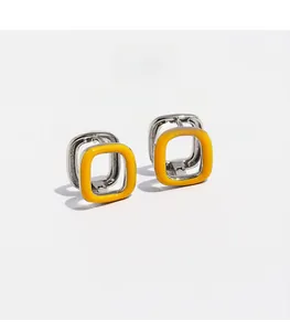 Detailed view of square hoop earrings featuring yellow enamel inlay and zircons