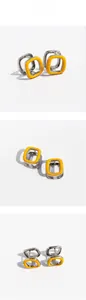 Detail view of silver square hoop earrings with vibrant orange enamel and hard shadows