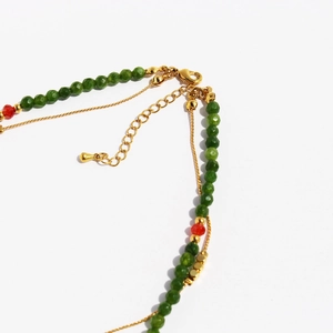 Faceted green stone beaded necklace with gold metal accents and adjustable lobster clasp