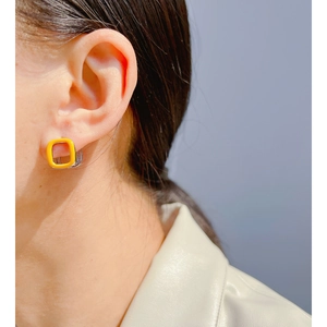 Minimalist square geometric earrings in bright yellow enamel and silver finish on model