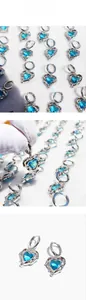 Macro detail of silver heart earrings with liquid lava texture and blue zircon stones