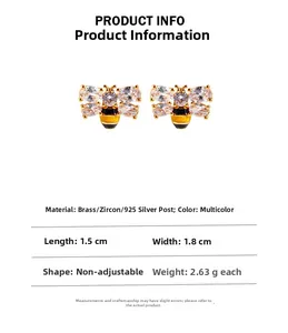 Detailed view of handmade enamel bee earrings with gold finish and sparkling zircon stones
