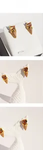 Detail of ice cream cone earrings with amber heart stones and pavé set crystals