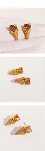 Close-up detail of ice cream cone earring with heart-shaped zircon and pave crystals