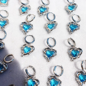 Lava silver hoop earrings with ocean blue heart shaped cubic zirconia in group display