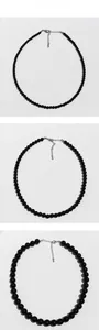 Detailed comparison of three black onyx beaded necklaces with silver lobster clasps