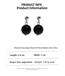 Detailed specs of black agate ball drop earrings with silver needles and brass finish
