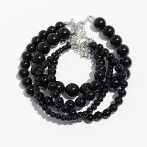 Elegant black onyx bead necklace set with three varying sizes and silver lobster clasp