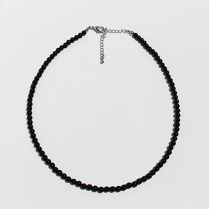 Elegant beaded necklace with black onyx stones and silver-tone lobster clasp closure