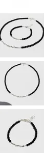 Detail showing black onyx bead necklace and irregular silver bead bracelet set