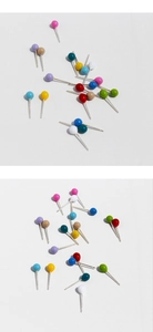Macro detail of vibrant colorful candy-colored round stud earrings in multi-color set
