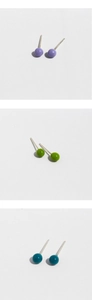 Close-up of S925 sterling silver studs with purple, green and blue enamel balls