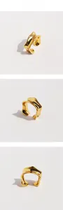 Detail of gold irregular textured clip-on earrings with minimalist molten lava design