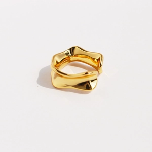 Modern gold irregular wave ring with a wide lava flow design and mirror polished finish