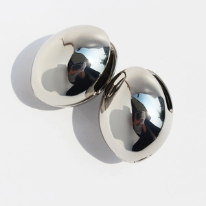 Polished silver oversized hollow hemispherical metal hoop earrings in minimalist style
