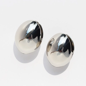 Modern hollow oval silver stud earrings with high-polish finish on white background