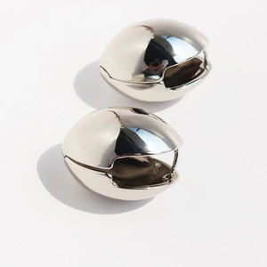 Chunky silver oval drop earrings with mirror polished finish and hollow geometric design