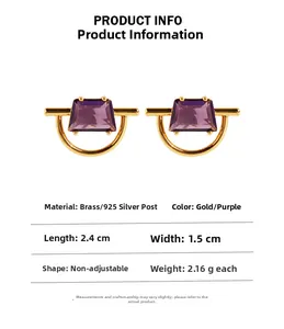 Detail of geometric brass earrings with purple trapezoid zircon and 925 silver needles
