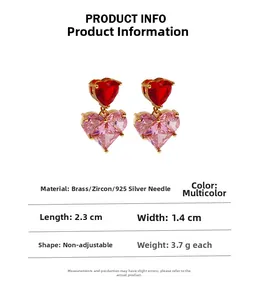 Detail showing brass heart earrings with zircon, size 2.3cm by 1.4cm, and 925 silver needles