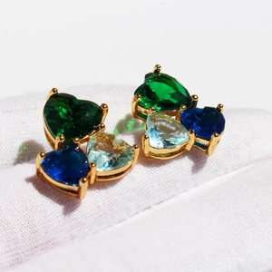 Creative blue zircon heart stud earrings with triple gemstone design in gold setting