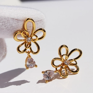 Elegant gold hollow flower earrings with teardrop zirconia pendant for women