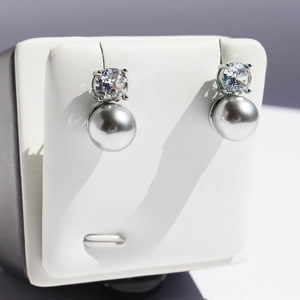 S925 sterling silver stud earrings featuring round gray pearls and sparkling cubic zirconia