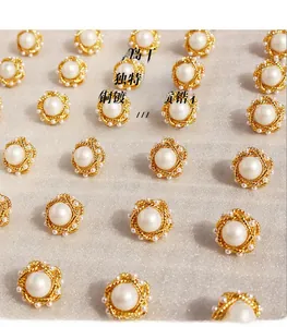 Macro detail of French vintage gold twist earrings with large pearl and zircon accents