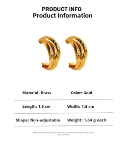Detailed view of gold plated brass C-shaped earrings with feather texture and measurements