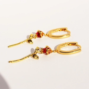 Elegant gold U-shaped hoop earrings with handcrafted red enamel rose flower pendants