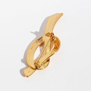 Abstract golden ribbon knot brooch with brushed metal texture and secure safety pin back