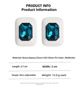 Detail showing white enamel square earrings with blue zircon and 925 silver needle