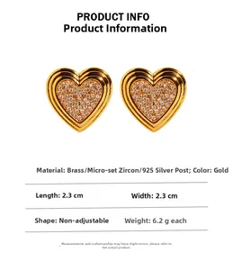 Macro detail of gold-plated heart earrings with micro-set zircon and 925 silver posts