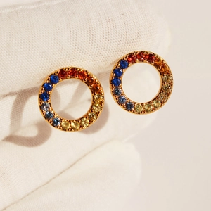 Rainbow cubic zirconia gold hoop earrings featuring vibrant gradient colored gemstones