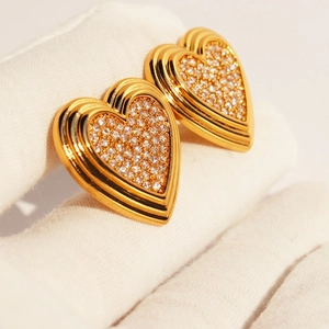 Elegant gold heart earrings with micro-set zircons and geometric tiered design