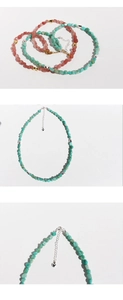 Detalle del collar de cuentas hecho a mano con amazonita, cuarzo y un colgante de corazón
