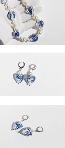 Detail of blue and white porcelain heart pendant necklace with pearl earring set