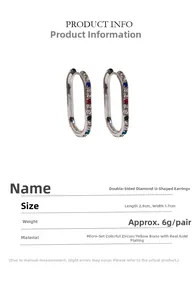 Detail view of silver U-shaped earrings with colorful zircon stones and 2.9cm size label