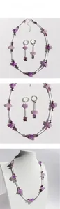 Detail of natural purple stone necklace and earring set with silver metal tube accents
