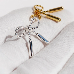 Bow knot stud earrings with twisted rope texture in gold and silver finish