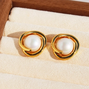 Elegant gold layered hollow circle earrings with vintage pearls on velvet background