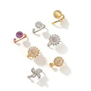Collezione di anelli rotanti in zirconia oro e argento con design floreali