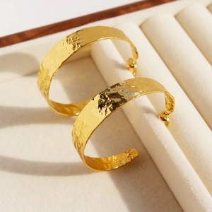 Vintage chunky gold C-shaped hoop earrings with hammered metal texture for women