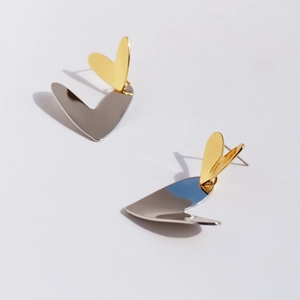 Modern two-tone heart earrings with gold and silver mirror finish in geometric origami style