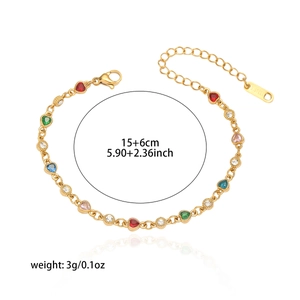 Close-up of gold heart bracelet with emerald stones and 15+6cm length dimensions