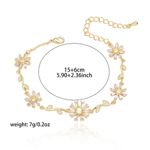 Detail of gold daisy bracelet with crystal petals and size markings 15+6cm