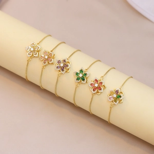 Adjustable golden bracelets featuring rotating colorful zircon flower pendants for women